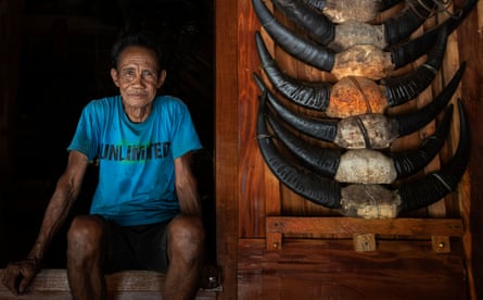A Sumba local sits at the front of his traditionally built home in West Sumba regency, Nusa Tenggara, Indonesia