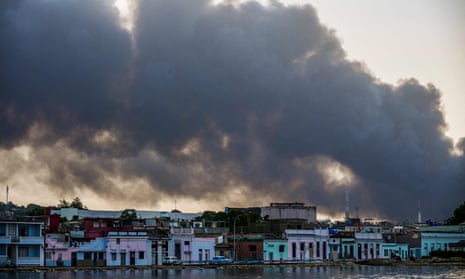 Smoke rises from the massive fire at a fuel depot in Matanzas, Cuba. 