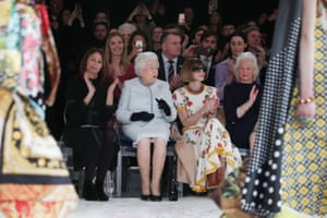 The Queen watches designer Richard Quinn’s runway show next to Anna Wintour during London fashion week.