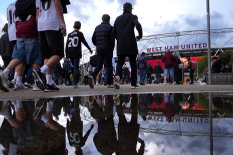 West Ham fans make their way to the stadium before the match