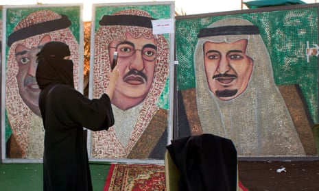 Paintings showing Saudi King Salman, right, and Crown Prince Mohammed bin Nayef in Jeddah
