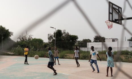 A view of children playing on a basketball court