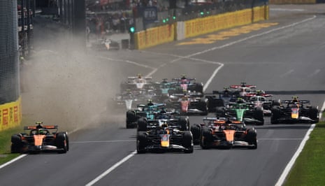 Max Verstappen forces Lando Norris onto the grass in the run up to the first corner.