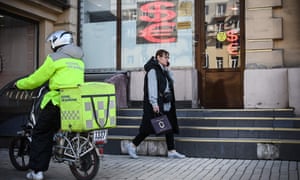 A pedestrian walks past a currency exchange office in central Moscow on April 18, 2022. The Central Bank of Russia has resumed the opportunity for banks to sell foreign currency cash to citizens since April 18, according to local reports.