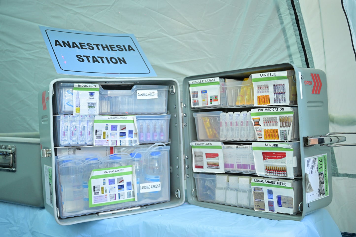 A metal case full of vials of drugs and tablets A metal case full of vials of drugs and tablets