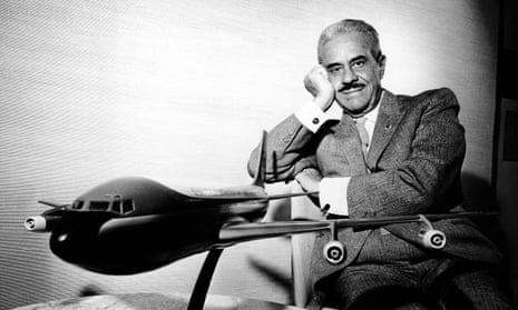 The master … Raymond Loewy poses in his office with a model of the presidential plane.
