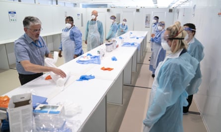 Medical staff receive PPE training at the new Nightingale hospital in Manchester.