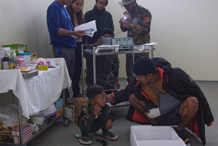 Soldiers assemble newly arrived hospital equipment in Tikir
