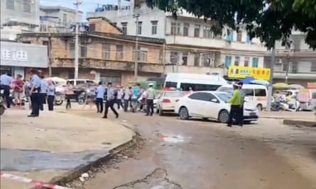 A police cordon is placed in the aftermath of a stabbing attack at a kindergarten in Lianjiang county, Guangdong province, footage from social media shows