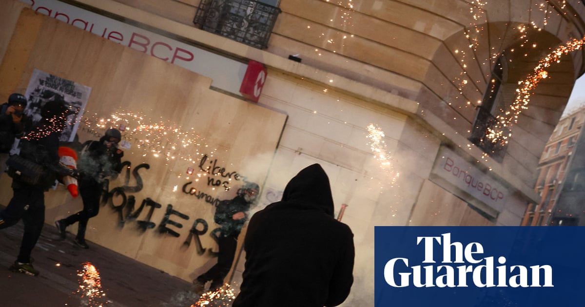 Police clash with masked rioters after largely peaceful protests across France
