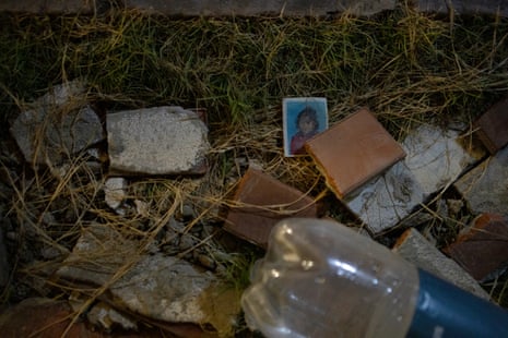 A photo of a child lies among earthquake wreckage in La Guaira.