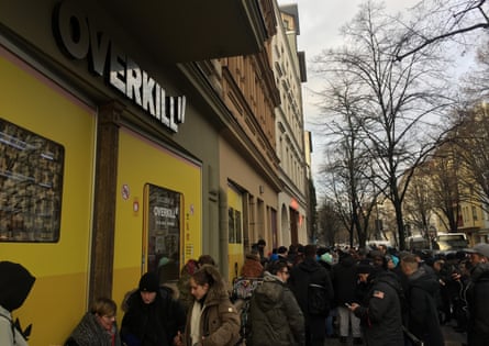 Shoppers queue outside Overkill in Berlin to get their hands on the limited edition trainers.