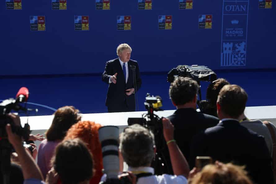 Boris Johnson speaking to reporters on his arrival at the Nato summit.