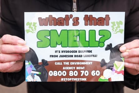 A resident holds a campaign leaflet saying: ‘What’s that smell? It’s hydrogen sulphide from Jameson Road landfill’