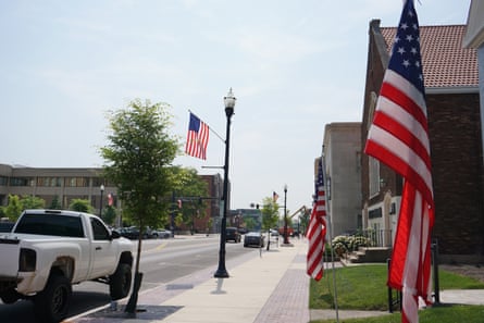 Homes, US flags and a truck.