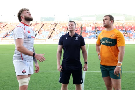 Referee Eoghan Cross oversees the prematch toss with Warner Dearns of Japan and Harry Wilson of Australia.