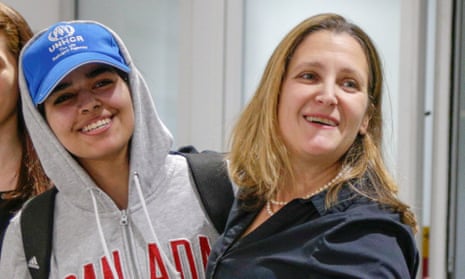 Rahaf Mohammed al-Qunun is greeted by Canada’s foreign minister Chrystia Freeland.