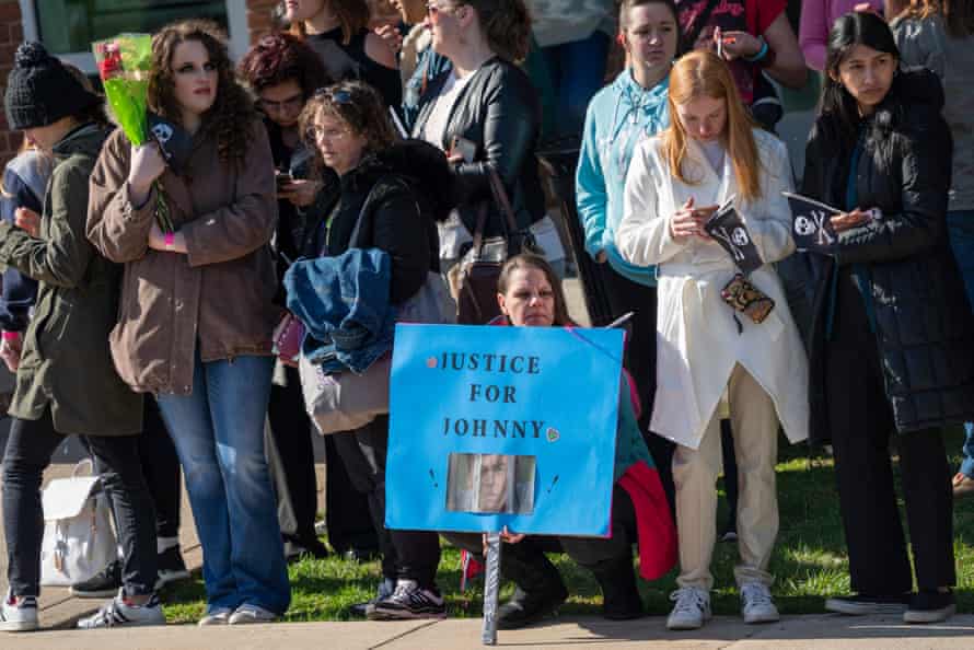 Fans wait for the arrival of Depp outside the courthouse in Fairfax, Virginia, on 11 April.