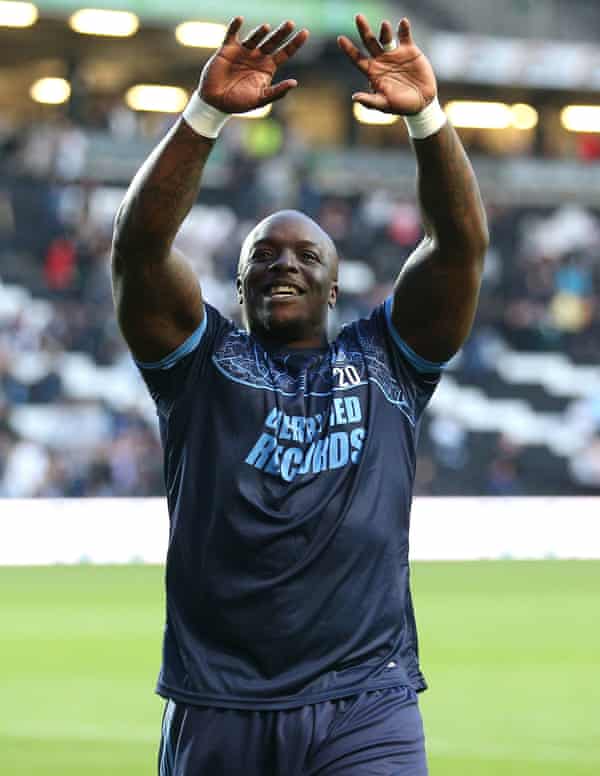 Adebayo Akinfenwa celebrates after Wycombe defeated MK Dons to reach the League One playoff final.