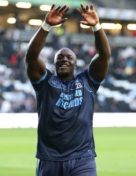 Adebayo Akinfenwa celebrates after Wycombe beat MK Dons to reach the League One playoff final.