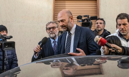 Lucio Arcidiacono​, commander of the Carabinieri​ Ros, surrounded by journalist​s near the apartment where inv​estigators said they have foun​d a secret bunker used by the ​mafia boss Matteo Messina Dena​ro.