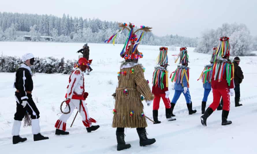People attend the Masopust Carnival, a ceremonial Shrovetide door-to-door procession, in Vitanov near Pardubice, Czech Republic.