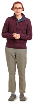 Sophie: white woman with red headscarf, glasses, knitwear and checked trousers stands hands clased