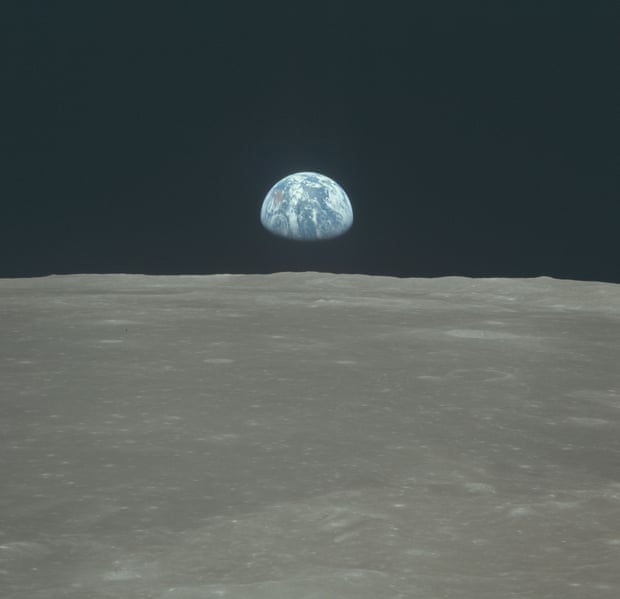Earth rises above the moon’s horizon during the Apollo 11 lunar mission, July 1969