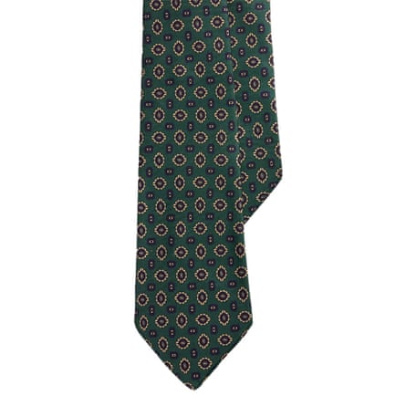 Ralph Lauren tie. It is green with a printed motif of tossed “neats” (small-scale geometric figures).