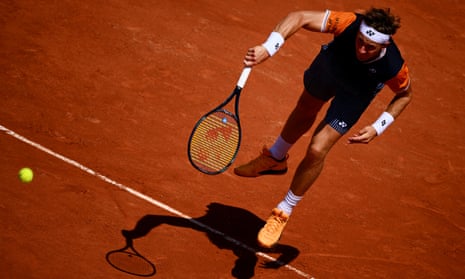 Casper Ruud fires down a serve against Giulio Zeppieri.