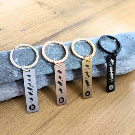 Keyring and fob printed with a code in the form of dots and various lengths of dash, and a Spotify logo