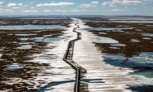 An oil pipeline stretches across the landscape outside Prudhoe Bay in North Slope Borough, AK on May 25, 2019.