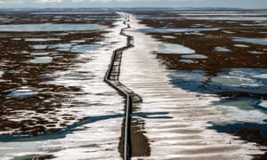 An oil pipeline stretches across the landscape outside Prudhoe Bay in North Slope, Alaska, US.