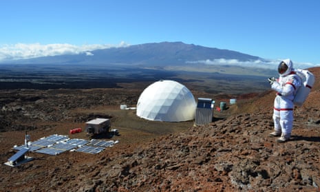 Kate Greene in her spacesuit on the volcano of Mauna Loa, with the geodesic dome she called home in the background.