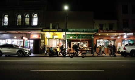 Food delivery bike riders line the streets of Newtown waiting to collect food from restaurants