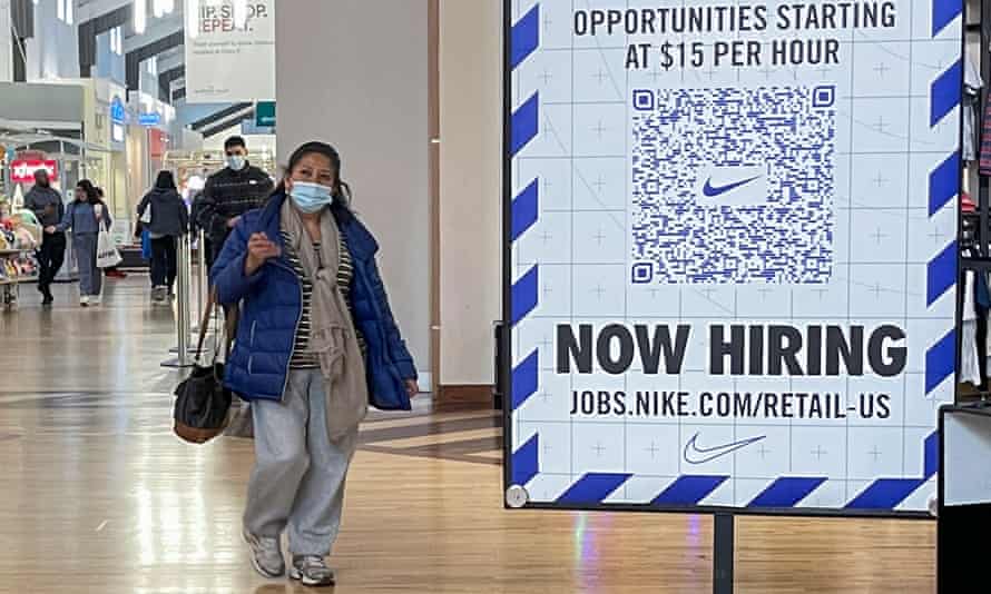 A help wanted sign appears in a shopping mall in Gurnee, Illinois, last month. Joe Biden added more jobs in 2021 than any president in his first year.