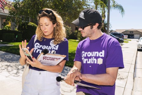A woman and a man canvassing a neighborhood