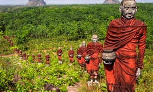 Hundreds of statues of monks collecting alms surround the massive Win Sein Taw Ya Buddha in Mawlamyine.