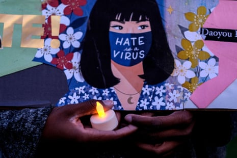 A woman attends a candlelight vigil in California against Asian American Pacific Islander hate and violence.