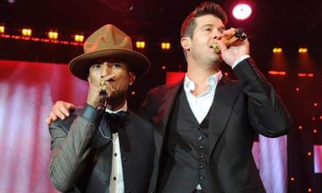 ‘It doesn’t matter that that’s not my behaviour’ … Pharrell Williams and Robin Thicke perform at the Grammy awards pre-gala in 2014.
