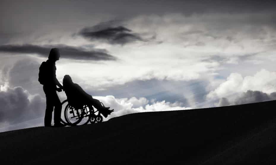 Person pushing a wheelchair