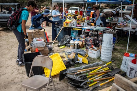 people grabbing supplies