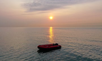 An empty dinghy floats in the Channel near Dover, England.