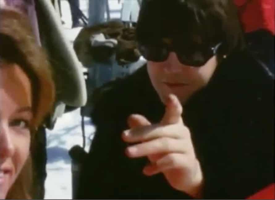Paul McCartney points to the camera