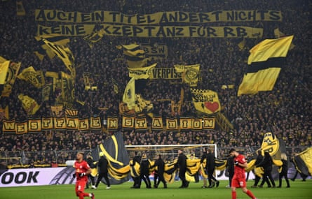 Dortmund fans raise a banner which reads: ‘A title doesn’t change anything, no acceptance for RB’