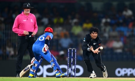 Rachin Ravindra of New Zealand celebrates the wicket of Rahmat Shah.