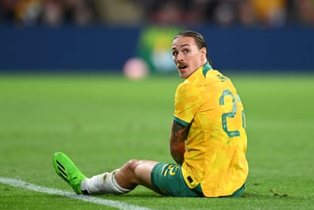 Jackson Irvine on the pitch wearing the green and gold Socceroos uniform