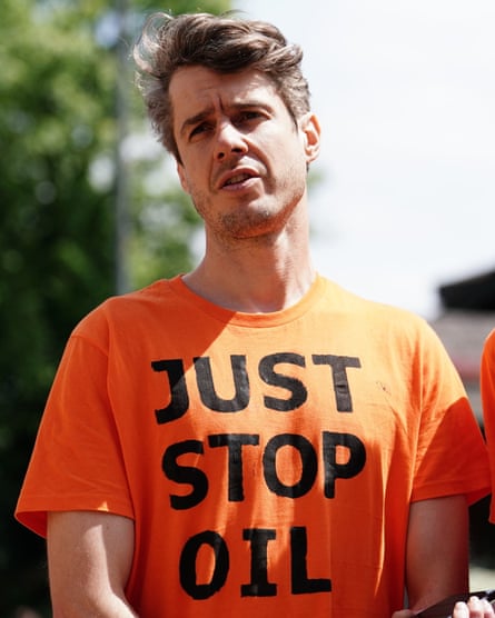 Patrick Hart wearing a Just Stop Oil T-shirt