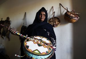 A Tuareg woman who is an imzad instrument maker poses for a picture