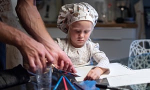 Cederström’s daughter, Ellen, gets distracted while helping cook dinner.